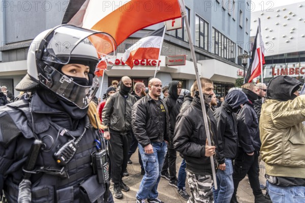 The neo-Nazi group Jung und Stark, JS, demonstrates in the city centre of Essen, demanding the remigration of foreigners, chanting Deutschland den Deutschen Ausländer raus, approx. 150 ultra right-wingers, dressed in black and wearing typical scene clothing, several groups demonstrate against the Nazi march, Essen, North Rhine-Westphalia, Germany, Europe