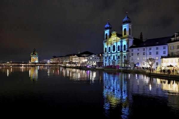 Water tower and Jesuit church on the right with light installation, on the Reuss at dusk, Old Town, Lilu, Light Festival 2025, Lucerne, Canton of Lucerne, Switzerland, Europe