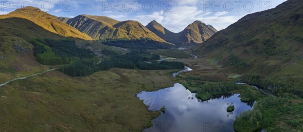 Mountains reflected in lake, morning light, sunny, autumn, aerial view, panorama, Lochan Urr, Glen Etive, Scottish Highlands, Scotland, Great Britain