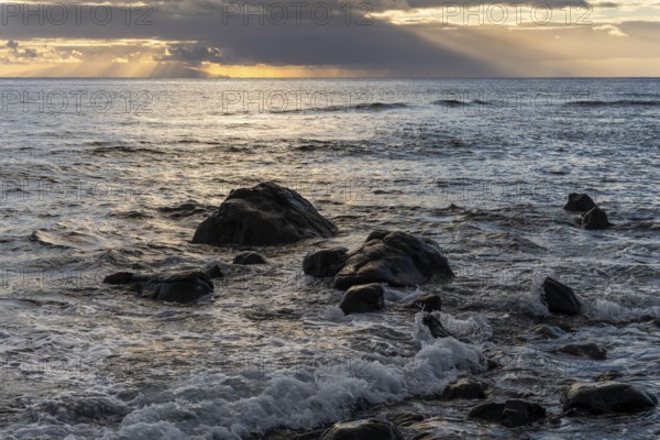 Rocks on the beach of Playa del Inglés. Sunset. Sea and waves. Valle Gran Rey, La Gomera, Canary Islands, Spain, Europe
