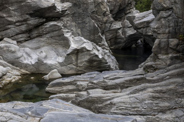 Rocks, granite rock formations in the Maggia River near Ponte Brolla, in the Maggia Valley, Valle Maggia, Canton Ticino, Switzerland, Europe