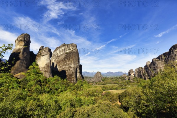 Hermitages between high rocks, monasteries on sandstone formations, Meteora, blue sky, spring weather, Thessaly, Greece, Europe