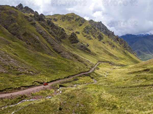 Off-road camper van crosses the Peruvian Andes, Pallay Punchu Rainbowmountain, Layo, Peru, South America