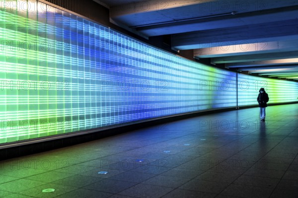 Passage under Essen's main railway station, connects entrances to the city and the main railway station, with the underground station, illuminated, LED wall, few people, Germany, Europe