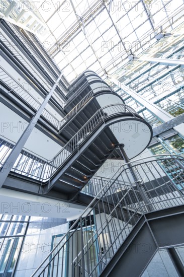 Rising staircase in a modern building with glass roof, Böblingen, Germany, Europe