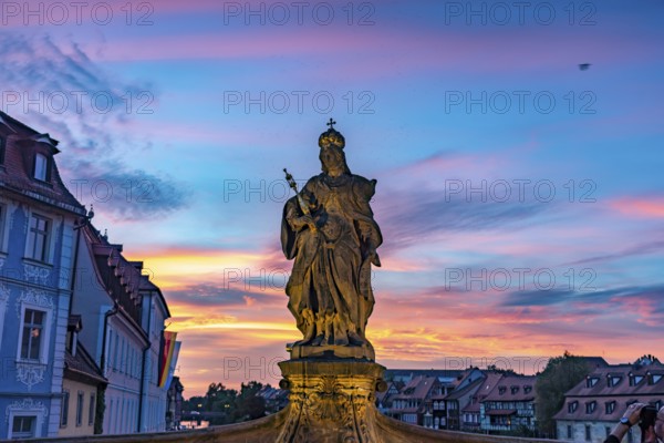 Statue of Empress Cunegonde on the Lower Bridge in Bamberg at sunset, Upper Franconia, Bavaria, Germany, Europe
