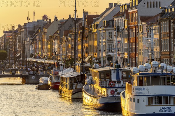 Colourful houses, restaurants and historic ships on the Nyhavn canal and harbour, Copenhagen, Denmark, Europe