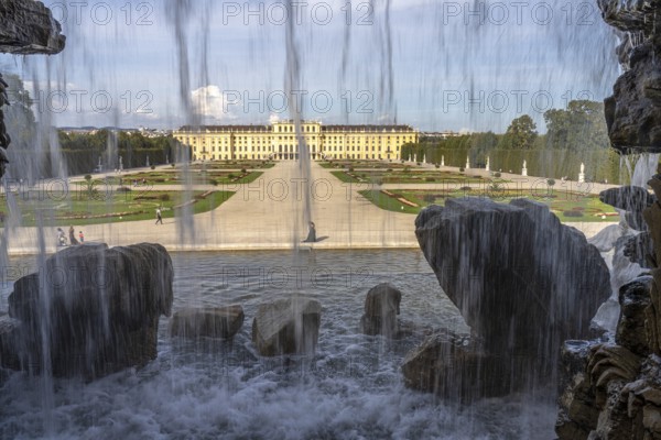 View through the Neptune Fountain to Schönbrunn Park and Palace, UNESCO World Heritage Site in Vienna, Austria, Europe