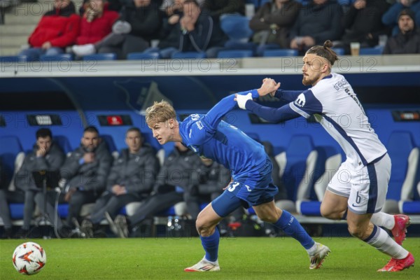 Football UEFA Europa League, 2024/25 season, matchday 7: TSG Hoffenheim v Tottenham Hotspur. Picture: Duel between Max Moerstedt (33, Hoffenheim) and Radu Dragusin (6, Tottenham)