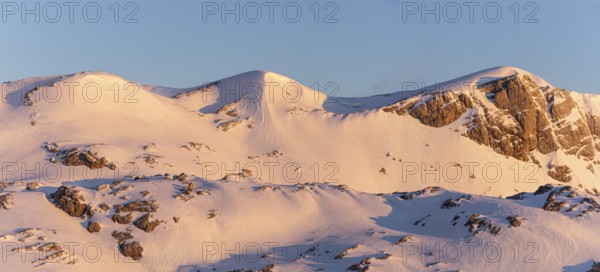 Snow-covered mountains in the sunlight offer a tranquil winter landscape, Upper Austria, Austria, Europe