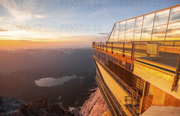 Modern mountain station of the Bavarian Zugspitze railway at the summit of the Zugspitze, view of Eibsee lake, at sunset, Wetterstein Mountains, Northern Limestone Alps, Bavaria, Germany, Europe