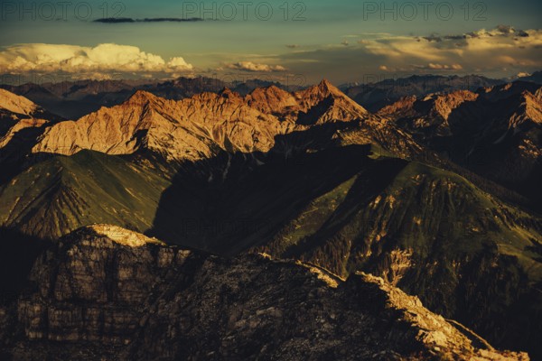 Thaneller summit at sunset in the Lechtal valley in Tyrol with a wonderful view of the surrounding mountains. Tyrol, Austria, Europe