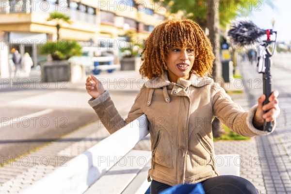 Millennial content creator latin young woman vlogging online in the city