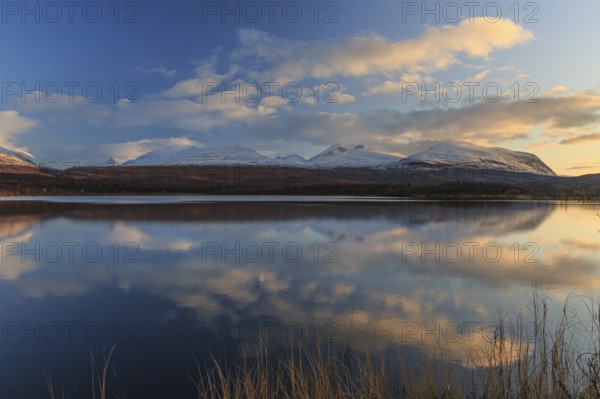 Mountains reflected in lake, autumn colours, sunny, evening light, Lapporten, Abisko National Park, Laponia, Lapland, Sweden, Europe