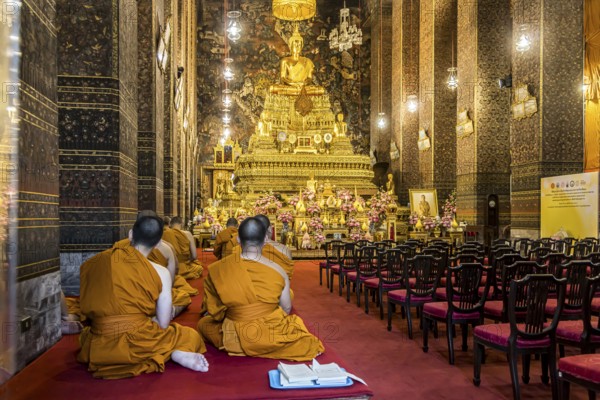Wat Pho temple in Bangkok near the Grand Palace. Buddhist monks during a religious ceremony. Bangkok, Thailand, Asia