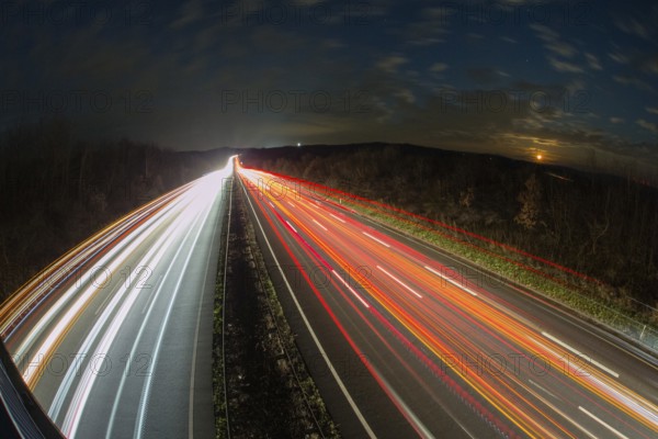 A7 Motorway, Autobahn, beside Kassel at night with light trails from the traffic headlights and taillights, Hesse, Germany, Europe