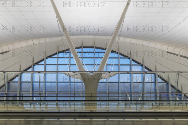 Abu Dhabi Airport, Zayed International Airport with passengers. The new Terminal A has a capacity of 45 million passengers per year. Modern architecture. Abu Dhabi, United Arab Emirates, UAE, Asia