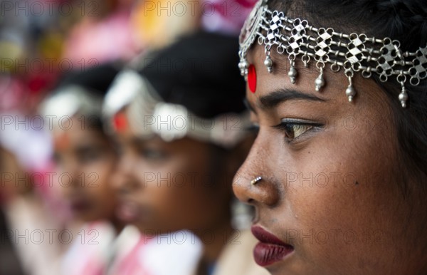 Girls from tea tribe community wait to perform traditional Jhumur dance, on the eve of 'Jhumoir Binandini' event at the Sarusajai Stadium in Guwahati, India on February 23, 2025. Jhumur Dance is a traditional folk dance popular in Assam, West Bengal, Jharkhand, and Odisha, mainly performed by the Adivasi (Tea Tribe) community and other indigenous groups