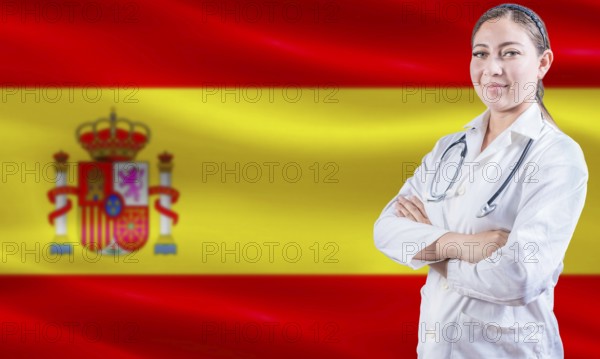 Female doctor on Spain flag. Doctor with crossed arms on Spain flag. Spain Health and Care concept