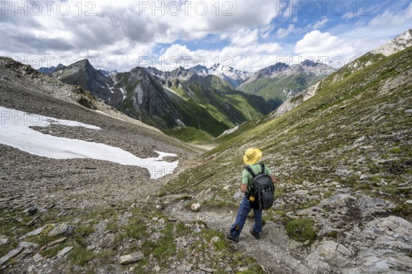 Mountaineer on a hiking trail enjoying the mountain panorama, mountain peak of the Venediger group with summit Rötspitz, Lasörling Höhenweg, Hohe Tauern National Park, East Tyrol, Tyrol, Austria, Europe