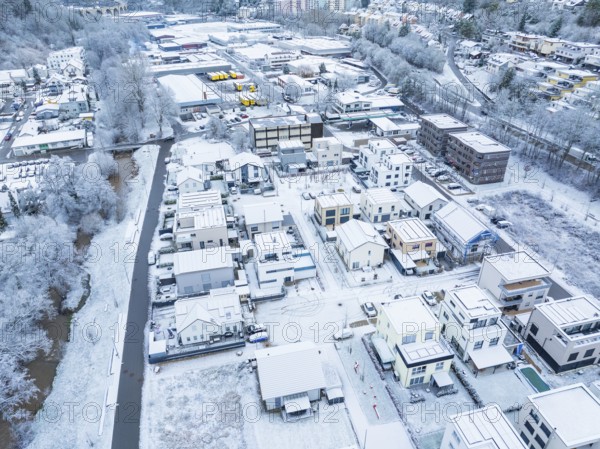 Snowy neighbourhood from the air with river, surrounded by hills and wooded areas, Nagold, Black Forest, Germany, Europe