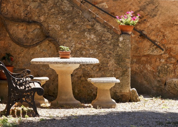 Garden with table and bench in Siena, Italy, Europe