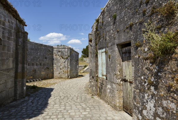 Walls of old fortifications and a cobblestone path on the island of Île-d'Aix, Charente-Maritime, France, Europe