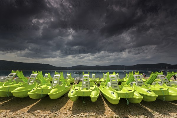 Pedal boats on the beach in Sainte Croix du Verdon, Lac de Sainte-Croix, thunderstorm atmosphere, Provence-Alpes-Côte d'Azur, Provence, France, Europe