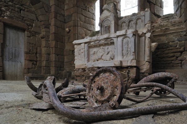 Burnt pram and altar in the church. The burnt village of Oradour-sur-Glane was destroyed on 10 June 1944 when 642 of its inhabitants, including woman and children, were massacred by a German Waffen SS company, Limousin, France, Europe