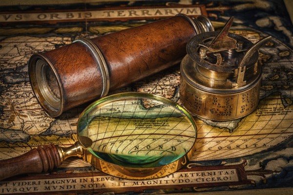 Travel geography navigation concept background, old vintage retro compass with sundial, spyglass and magnifying glass on ancient world map