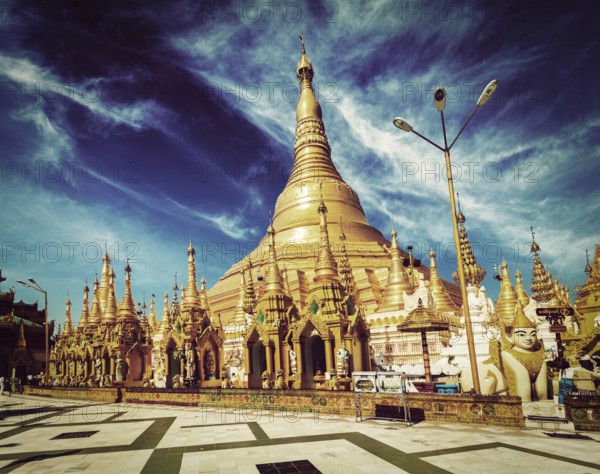 Vintage retro effect filtered hipster style image of Myanmer famous sacred place and tourist attraction landmark, Shwedagon Paya pagoda. Yangon, Myanmar, Asia