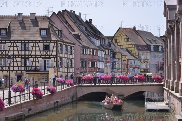 Excursion boat on a canal, La Petite Venise, Colmar, Département Haut-Rhin, Alsace, France, Europe