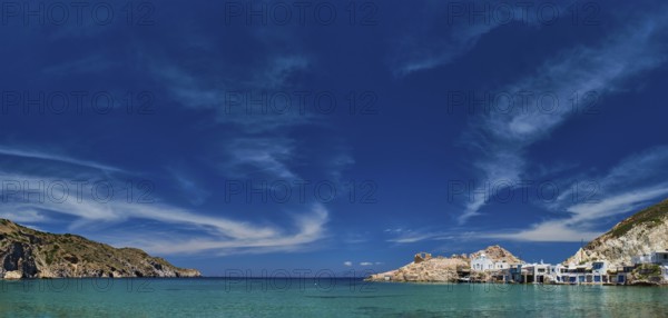 Panorama of the beach and fishing village of Firapotamos in Milos island, Greece, Europe