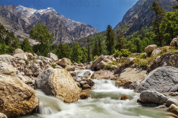 Mountain stream with waterfall cascades in Himalayas. Sangla valley, Himachal Pradesh, India, Asia