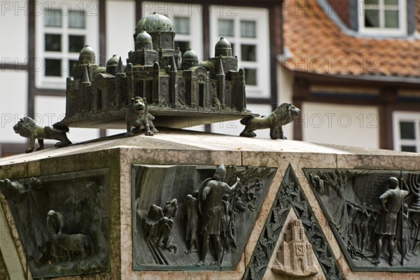 Bronze sculpture with a miniature of the city of Jerusalem on the ashlar of the synagogue memorial, Hildesheim, Lower Saxony, Germany, Europe
