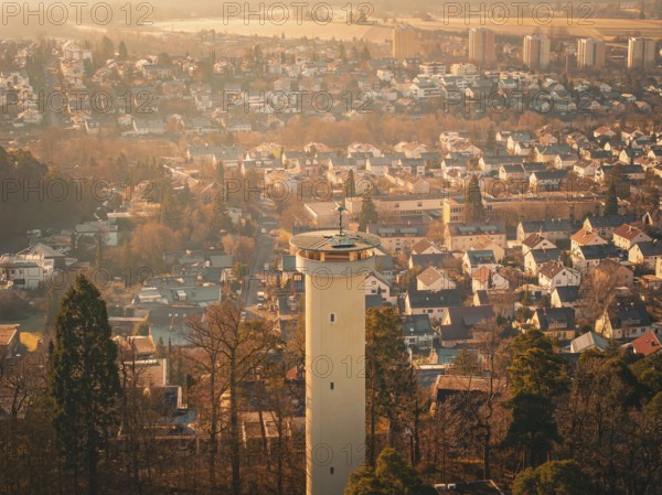 Town view with a tower in the centre and surrounding autumn-coloured trees, Böblingen, Germany, Europe