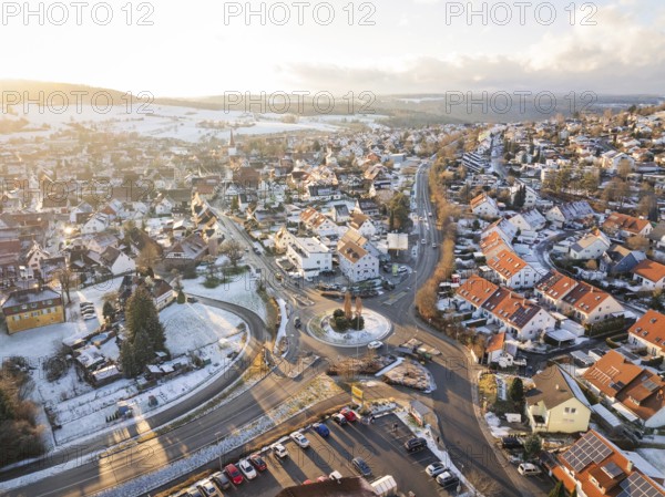 Winter city view with snow-covered streets and a roundabout, Calw- Stammheim, Black Forest, Germany, Europe
