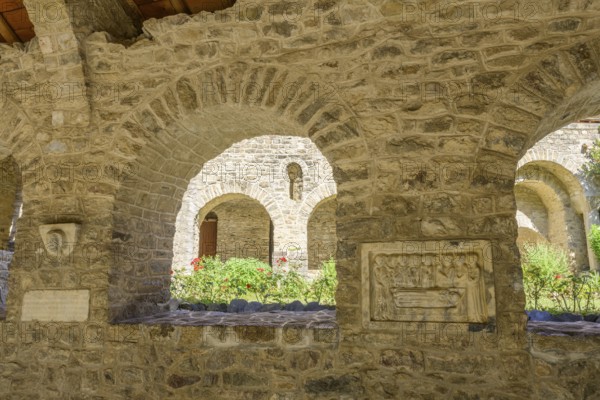 Tomb panels and inner courtyard at the cloister of Saint Martin du Canigou Abbey, Casteil, Département Pyrénées-Oriental, France, Europe