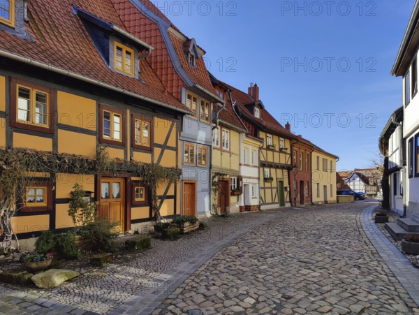 Half-timbered houses with cobblestones in Wassertorstraße, Old Town of the World Heritage City of Quedlinburg, Saxony-Anhalt, Germany, Europe