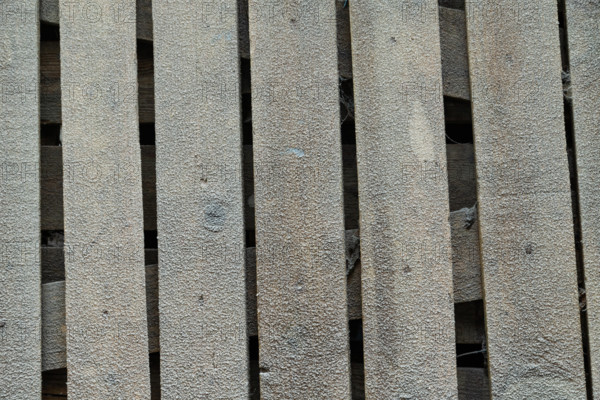 Wooden boards covered with hoarfrost. Abstract rustic background, winter concept. Frost texture, close up, flat lay, top view