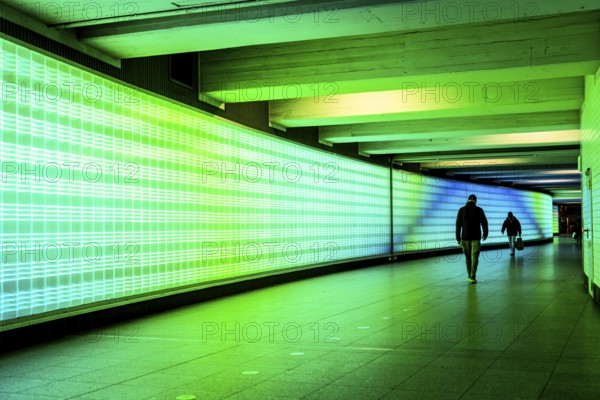 Passage under Essen's main railway station, connects entrances to the city and the main railway station, with the underground station, illuminated, LED wall, few people, Germany, Europe