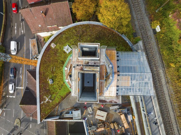 Aerial view of a construction site with rails and surrounding autumn vegetation, extension of the Calw central bus station for the new track of the Hermann Hessebahn, Calw, Black Forest, Germany, Europe