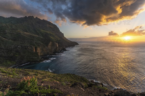 Landscape near Alojera with sea, coast, cliffs and mountains at sunset. Alojera, La Gomera, Canary Islands, Spain, Europe