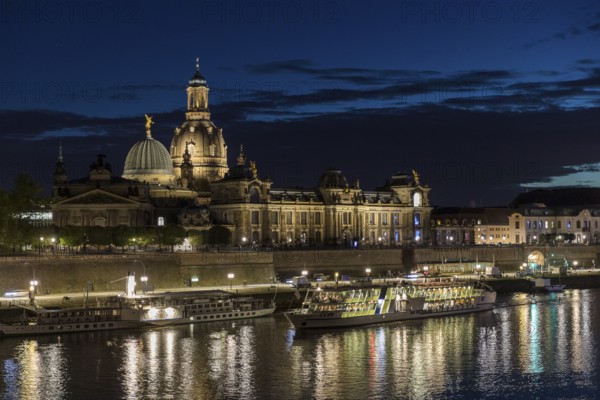 City view with Elbe in the evening, steamer departure, illuminated silhouette at the blue hour, Dresden, Saxony, Germany, Europe