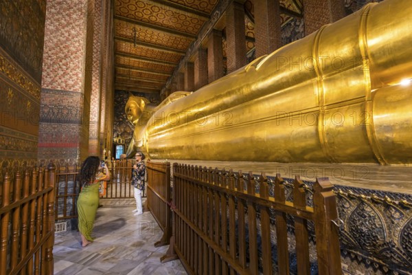 Wat Pho, temple of the reclining Buddha. Sightseeing attraction, architecturally significant temple complex. It is home to Phra Buddhasaiyas. The gilded Buddha statue is 46 metres long and 15 metres high. Bangkok, Thailand, Asia