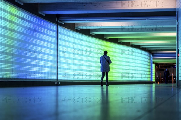 Passage under Essen's main railway station, connects entrances to the city and the main railway station, with the underground station, illuminated, LED wall, few people, Germany, Europe