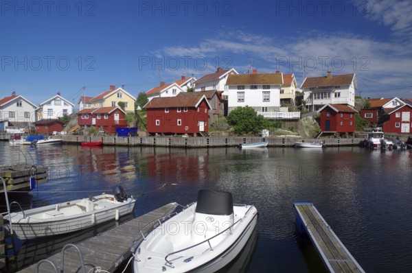 The small harbour of the archipelago island Gullhomen and small fishermen and leisure boats, holiday, Örust municipality, Sweden, Europe
