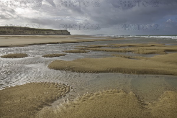 Tide pools on sand beach at low tide at Cap Blanc Nez, Pas-de-Calais, France, Europe