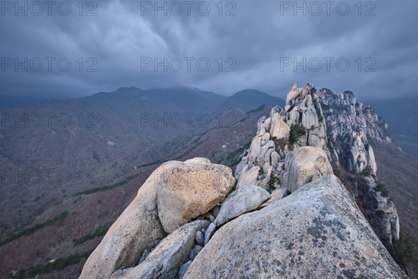 View of stones and rock formations from Ulsanbawi rock peak in stormy weather with clouds. Seoraksan National Park, South Corea