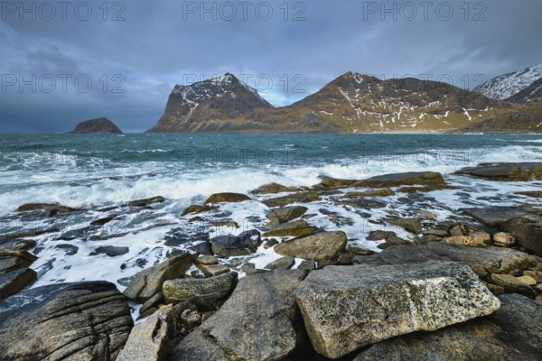 Rocky coast of fjord of Norwegian sea in winter. Lofoten islands, Norway, Europe